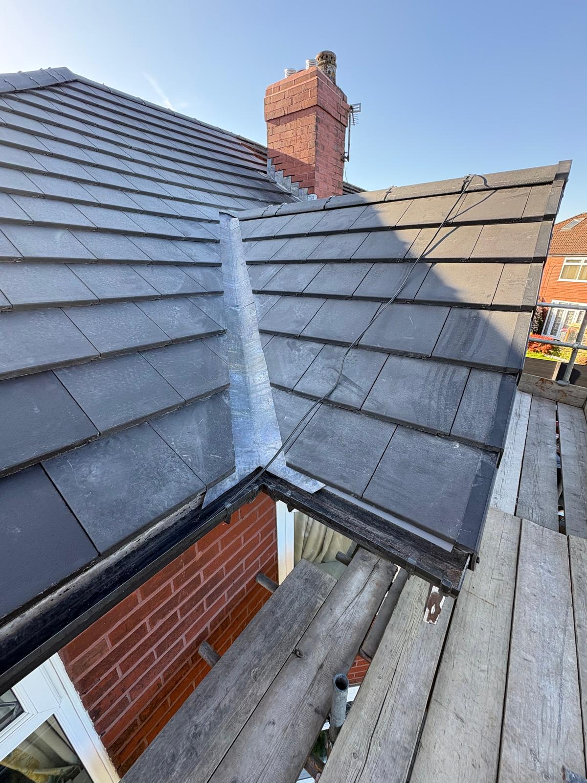 A lead valley between two roof slopes carrying a leak path