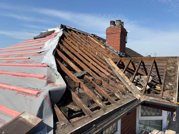 A damaged pitched conservatory roof panel